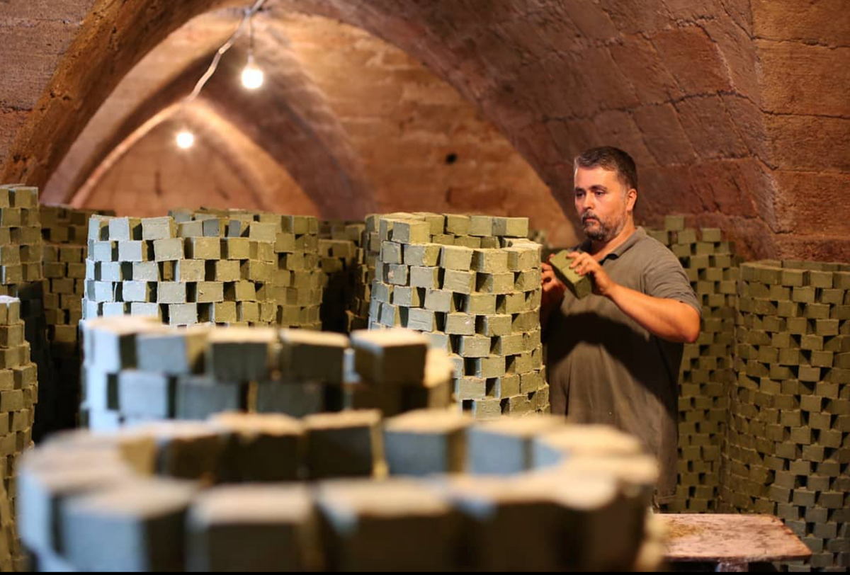 Freshly cut soap bars stacked by hand in the Tripoli workshop